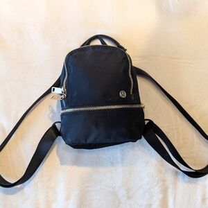 Lululemon City Adventurer BackpackMicro. Black with gold hardware.
